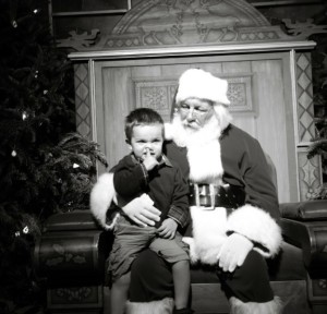 kid picks nose with santa, pictures of santa