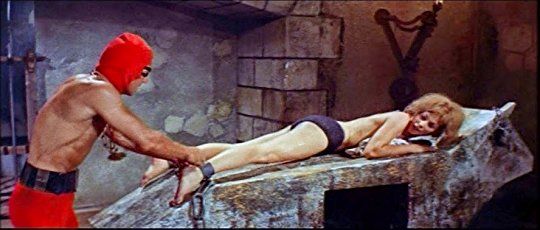 The Crimson Executioner has his way with the sexy women in 1965 Italian horror film, The Bloody Pit of Horror.