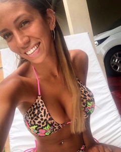 Sol Herrera smiles in string bikini