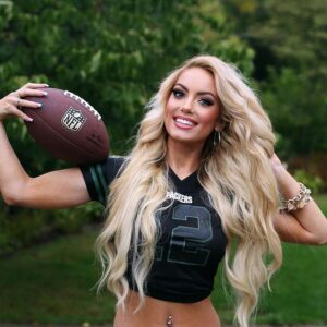 Holly Jo Anne White with a football