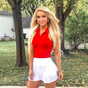 Holly Jo Anne White in a red tank top with a tennis skirt
