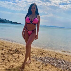 Marianna Ioannou in a pink bikini at the beach